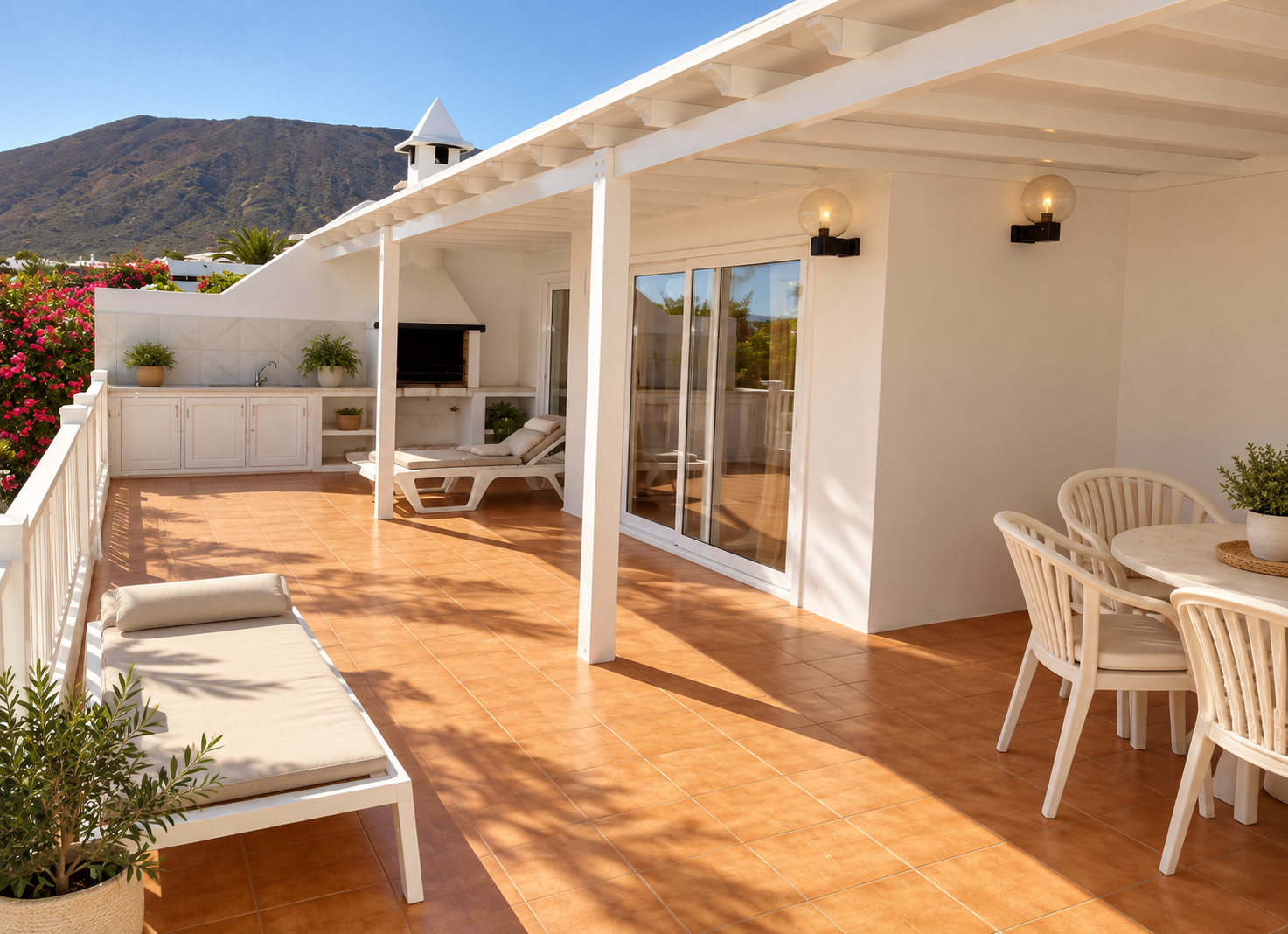 Sun terrace with outdoor kitchen and barbecue